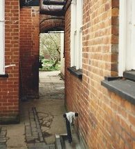 Kitchen passage towards back garden.  Door to dining room tucked round to the right
